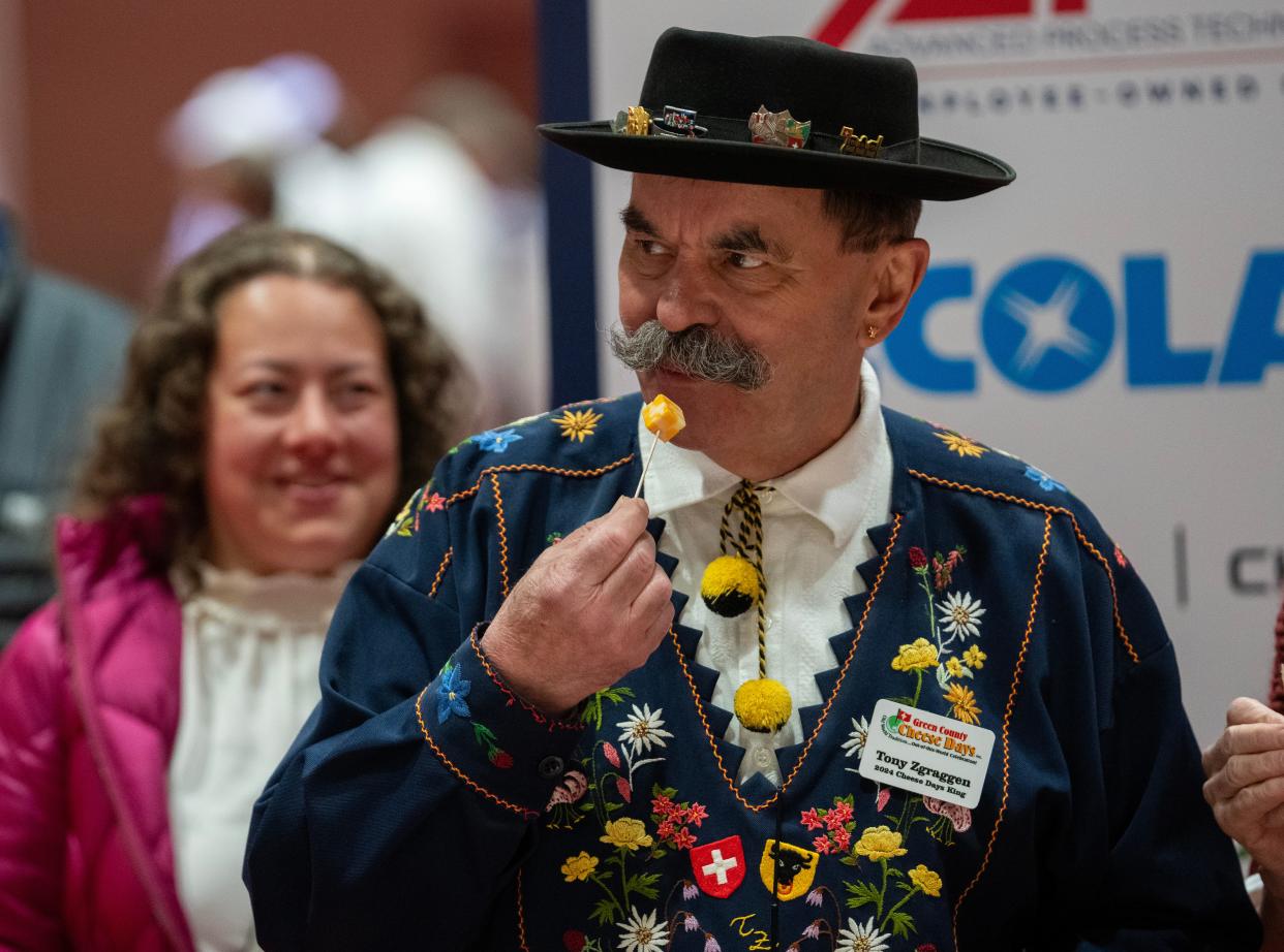 2024 Green County Cheese Days King Tony Zgraggen samples cheese at the World Cheese Championships Tuesday, March 5, 2024 at Monona Terrace Community and Convention Center Center in Madison, Wisconsin. He is from New Glarus. An international panel of judges is evaluating 3302 entries in 115 different cheese classes in addition to classes that include dairy products such as butter and yogurt. The biennial competition concludes Thursday. The event is free to the public who are invited to sample selected cheeses.