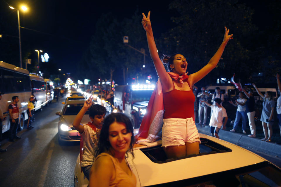 Supporters of Ekrem Imamoglu, the candidate of the secular opposition Republican People's Party, CHP, celebrate in central Istanbul, Sunday, June 23, 2019. In a blow to Turkish President Recep Tayyip Erdogan, Imamoglu declared victory in the Istanbul mayor's race for a second time Sunday after Binali Yildirim, the government-backed candidate conceded defeat in a high-stakes repeat election. (AP Photo/Lefteris Piarakis)