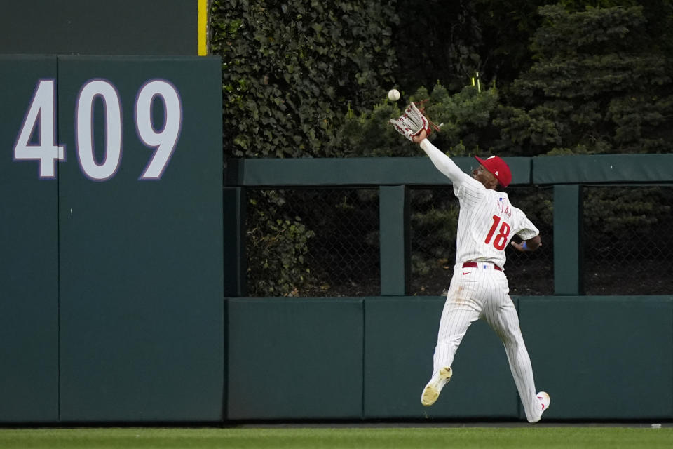 Philadelphia Phillies center fielder Johan Rojas catches a fly out by Chicago White Sox's Andrew Benintendi during the seventh inning of a baseball game, Saturday, April 20, 2024, in Philadelphia. (AP Photo/Matt Slocum)