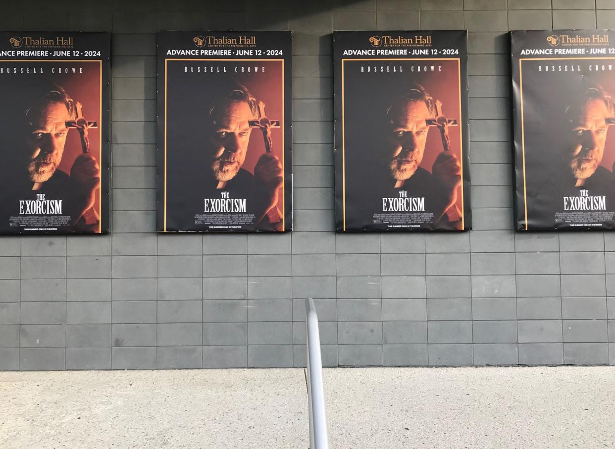 Posters for the June 12 premiere of "The Exorcism" outside of Thalian Hall.