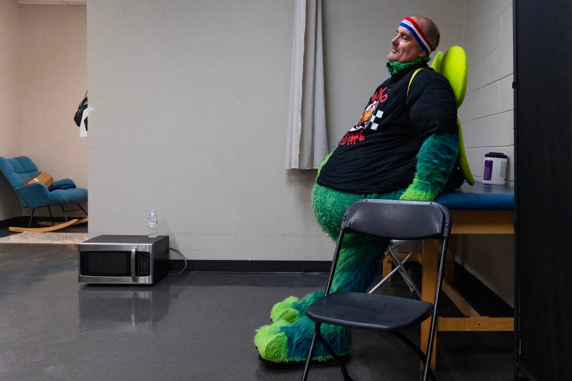 The State reporter Chris Trainor rests in the Fireflies mascot costume at Segra Park as the Fireflies play the Pelicans on Thursday, April 11, 2024.