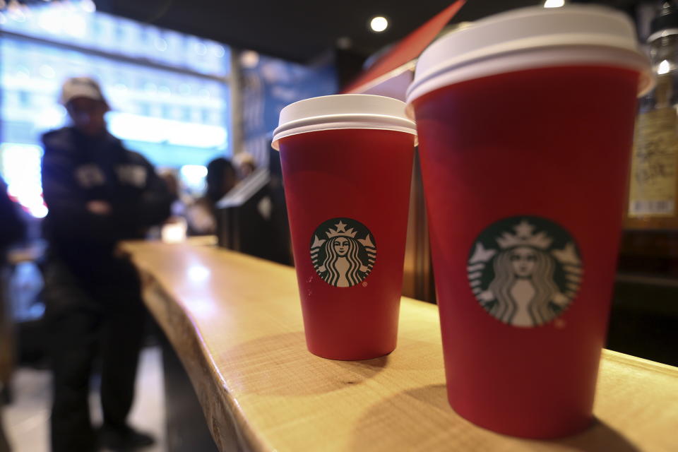 Starbucks holiday cups are pictured on a counter at a Times Square Starbucks in the Manhattan borough of New York November 11, 2015. REUTERS/Carlo Allegri