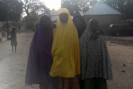 Unidentified girls, who say they fled during the attack by Boko Haram on their school, pose for a picture in Dapchi, Nigeria February 22, 2018. REUTERS/Ola Lanre