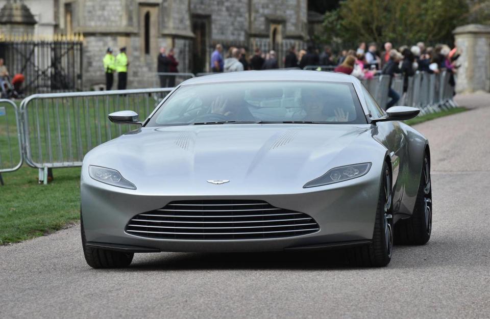 The couple left for the evening reception in an Aston Martin DB10 (Getty)