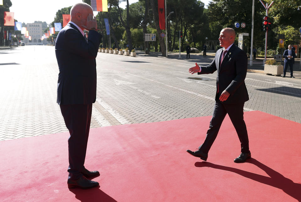 Albania's Prime Minister Edi Rama, left, welcomes his North Macedonian counterpart Dimitar Kovachevski ahead of a summit in Tirana, Albania, Monday, Oct. 16, 2023. Leaders from the European Union and the Western Balkans hold a summit in Albania's capital to discuss the path to membership in the bloc for the six countries of the region. (AP Photo/Franc Zhurda)