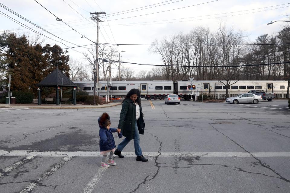 Maria Colaco of Katonah and her three-year-old daughter Charlie Colaco-Curry walk in downtown Katonah, Jan. 6, 2022. Maria had grand plans for a better Christmas in 2021, but she got sick with COVID, then her toddler daughter tested positive, and then her two other kids got it later on. They had to cancel their Christmas plans, including a visit from out of town family.