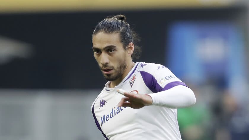 Fiorentina's Martin Caceres controls the ball during a Serie A soccer match between AC Milan and Fiorentina, at the San Siro stadium in Milan, Italy, Sunday, Nov. 29, 2020. (AP Photo/Luca Bruno)