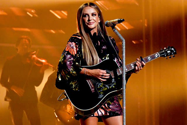 <p>Katherine Bomboy/NBC via Getty</p> Carly Pearce performs at the 2023 People's Choice Country Awards in Nashville.