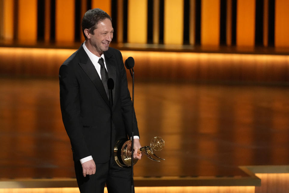 Ebon Moss-Bachrach accepts the award for outstanding supporting actor in a comedy series for "The Bear" during the 75th Primetime Emmy Awards on Monday, Jan. 15, 2024, at the Peacock Theater in Los Angeles. (AP Photo/Chris Pizzello)