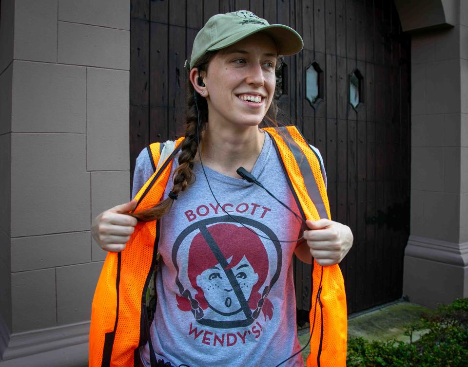 Miami resident Lindsay Richards wears a Boycott Wendy's T-shirt behind Palm Beach Town Hall on Friday.