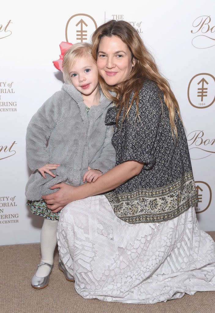 Drew Barrymore wears a patterned short sleeve shirt with a long skirt and Frankie Barrymore Kopelman wears a fuzzy jacket