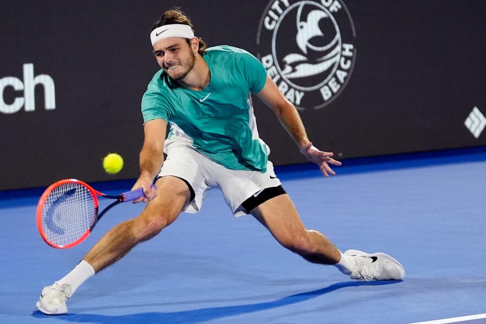 Taylor Fritz hits a return to Marcus Giron during their semifinal match at the Delray Beach Open tennis tournament, Saturday, Feb. 17, 2024, in Delray Beach, Fla. (AP Photo/Lynne Sladky)