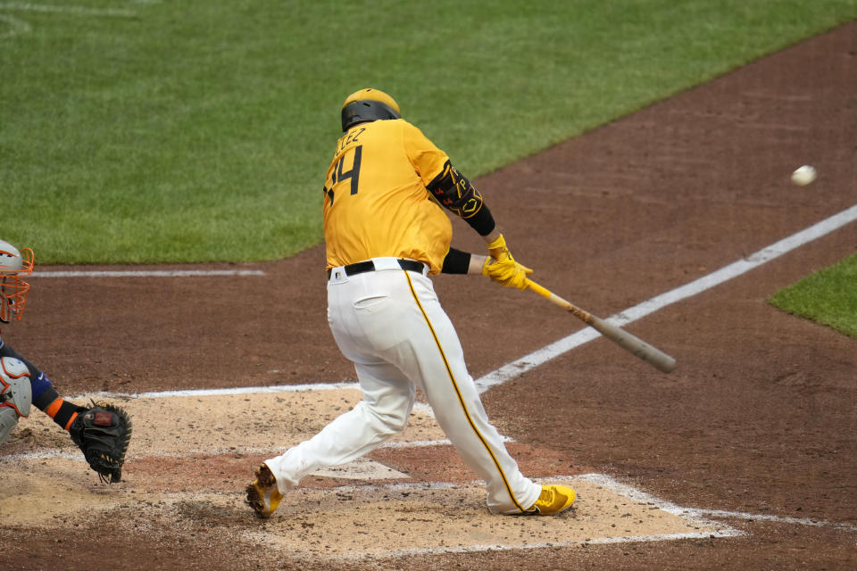 Pittsburgh Pirates' Rowdy Tellez follows through on a grand slam off New York Mets relief pitcher Ty Adcock during the eighth inning of a baseball game in Pittsburgh, Friday, July 5, 2024. (AP Photo/Gene J. Puskar)
