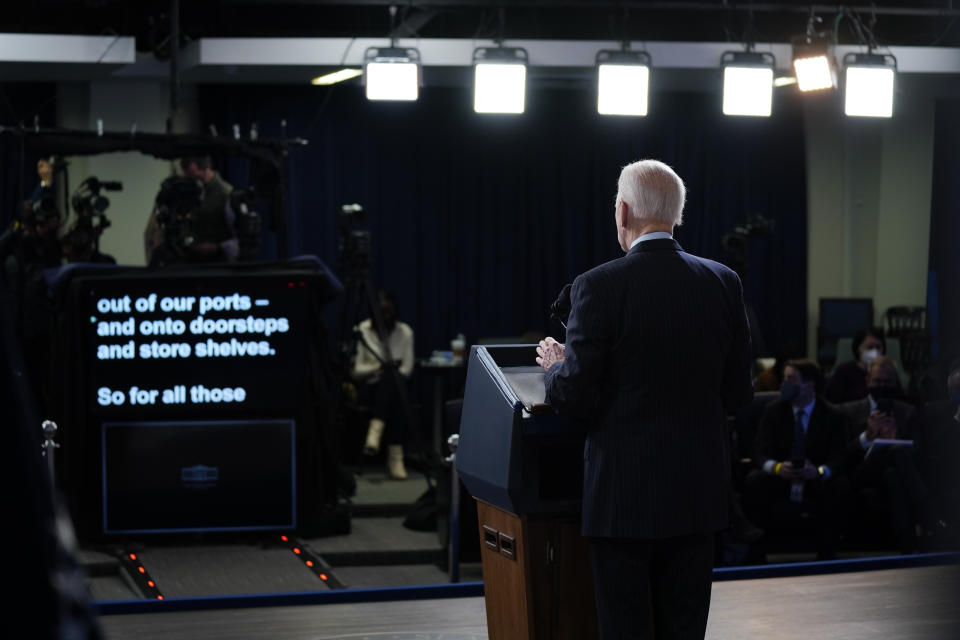 President Biden stands before a teleprompter, delivering remarks on the economy in the South Court Auditorium on the White House campus.