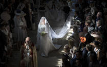 <p>Meghan walks down the aisle on her wedding day (Getty) </p>