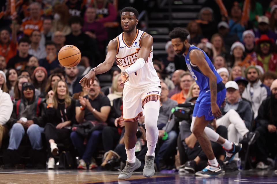 Chimezie Metu #4 of the Phoenix Suns passes the ball during the second half of the NBA game at Footprint Center on Dec. 25, 2023, in Phoenix, Arizona. The Mavericks defeated the Suns 128-114.