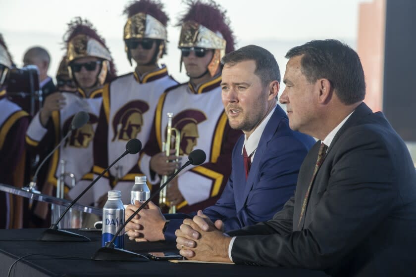 LOS ANGELES, CA - November 29 2021: New USC head football coach Lincoln Riley, left, and USC Athletic Director.