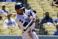 Los Angeles Dodgers' Mookie Betts hits a solo home run during the third inning of a baseball game against the Texas Rangers Sunday, June 13, 2021, in Los Angeles. (AP Photo/Mark J. Terrill)