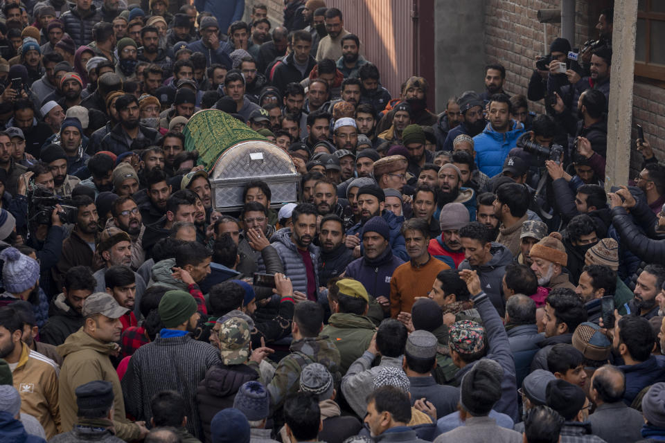 Kashmiris carry the coffin of police officer Masroor Ahmad Wani during his funeral procession in Srinagar, Indian controlled Kashmir, Friday, Dec. 8, 2023. Wani succumbed to his injuries at a hospital after he was wounded when suspected rebels shot at him while he was playing cricket with boys in his neighborhood in October. (AP Photo/Dar Yasin)