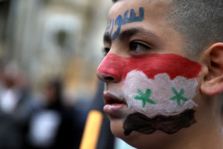 A Druze boy takes part in a rally over U.S. President Donald Trump's support for Israeli sovereignty over the Golan Heights, in Majdal Shams near the ceasefire line between Israel and Syria in the Israeli occupied Golan Heights March 23, 2019 REUTERS/Ammar Awad