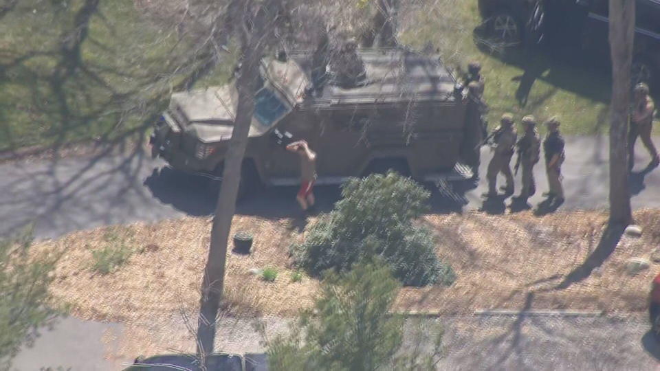 Jack Teixeira is taken into custody by federal law enforcement officials in North Dighton, Massachusetts, on Thursday, April 13, 2023. / Credit: CBS News