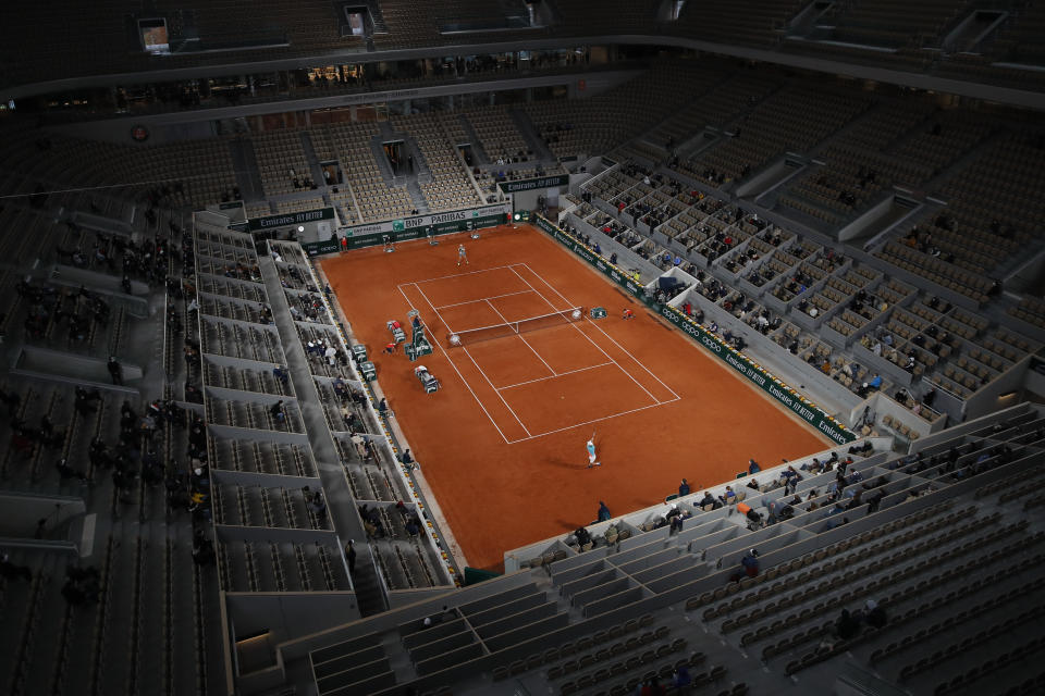 View of center court Philippe Chatrier as Belgium's David Goffin, near side, plays a shot against Italy's Jannik Sinner in the first round match of the French Open tennis tournament at the Roland Garros stadium in Paris, France, Sunday, Sept. 27, 2020. (AP Photo/Christophe Ena)