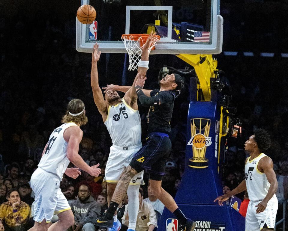 Lakers center Jaxson Hayes battles Utah Jazz guard Talen Horton-Tucker for a rebound