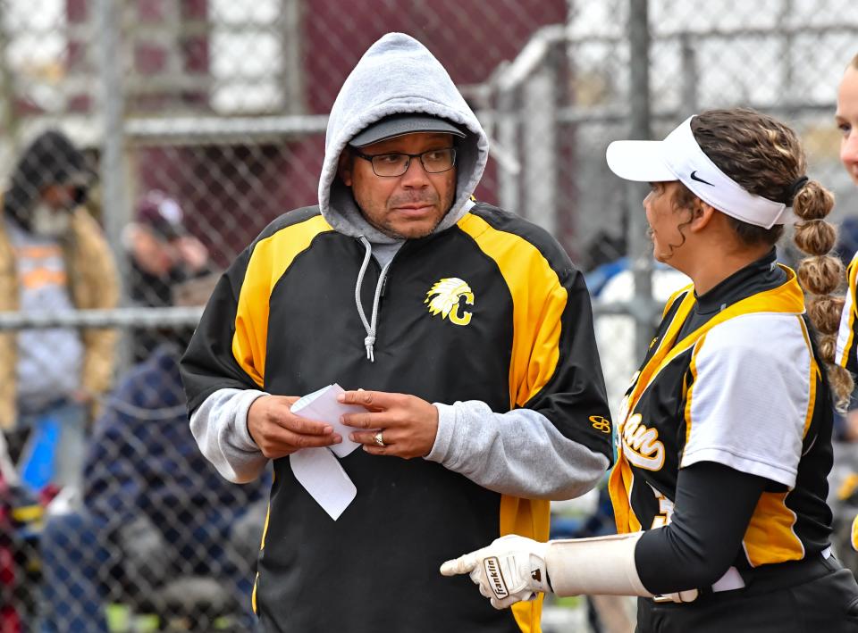 Cowan softball head coach Curtis Bynum talks to his daughter Aryonna during his team's game against Delta in the first round of the Delaware County softball tournament at Wes-Del High School on Tuesday, May 2, 2023.