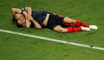 Soccer Football - World Cup - Semi Final - Croatia v England - Luzhniki Stadium, Moscow, Russia - July 11, 2018 Croatia's Dejan Lovren and Domagoj Vida celebrate after the match. REUTERS/Christian Hartmann