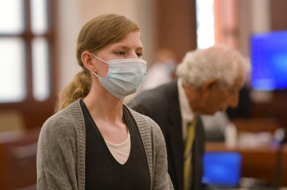 Julia Enright leaves the courtroom on Thursday.