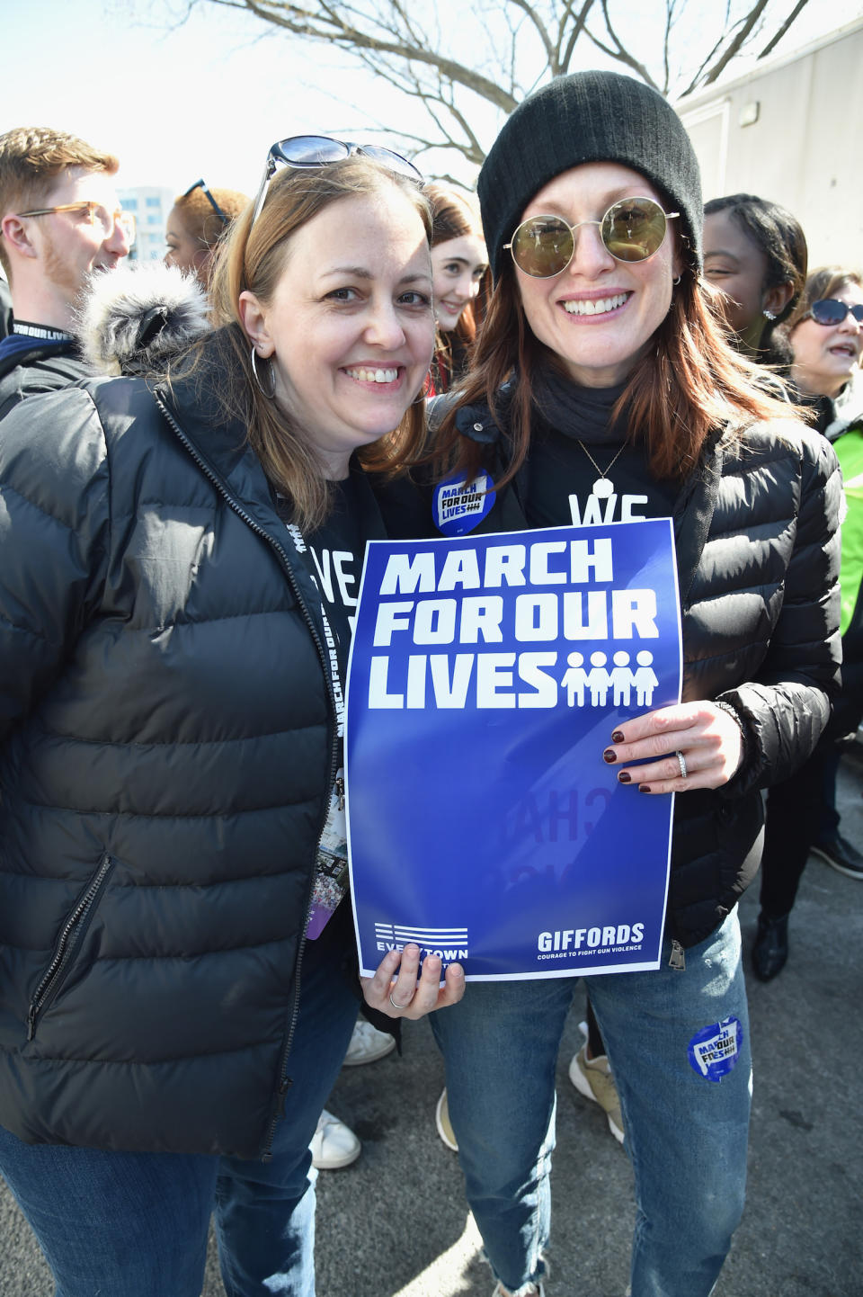 <p>Julianne Moore, right, poses with a sign in Washington, D.C. (Photo: Getty Images) </p>