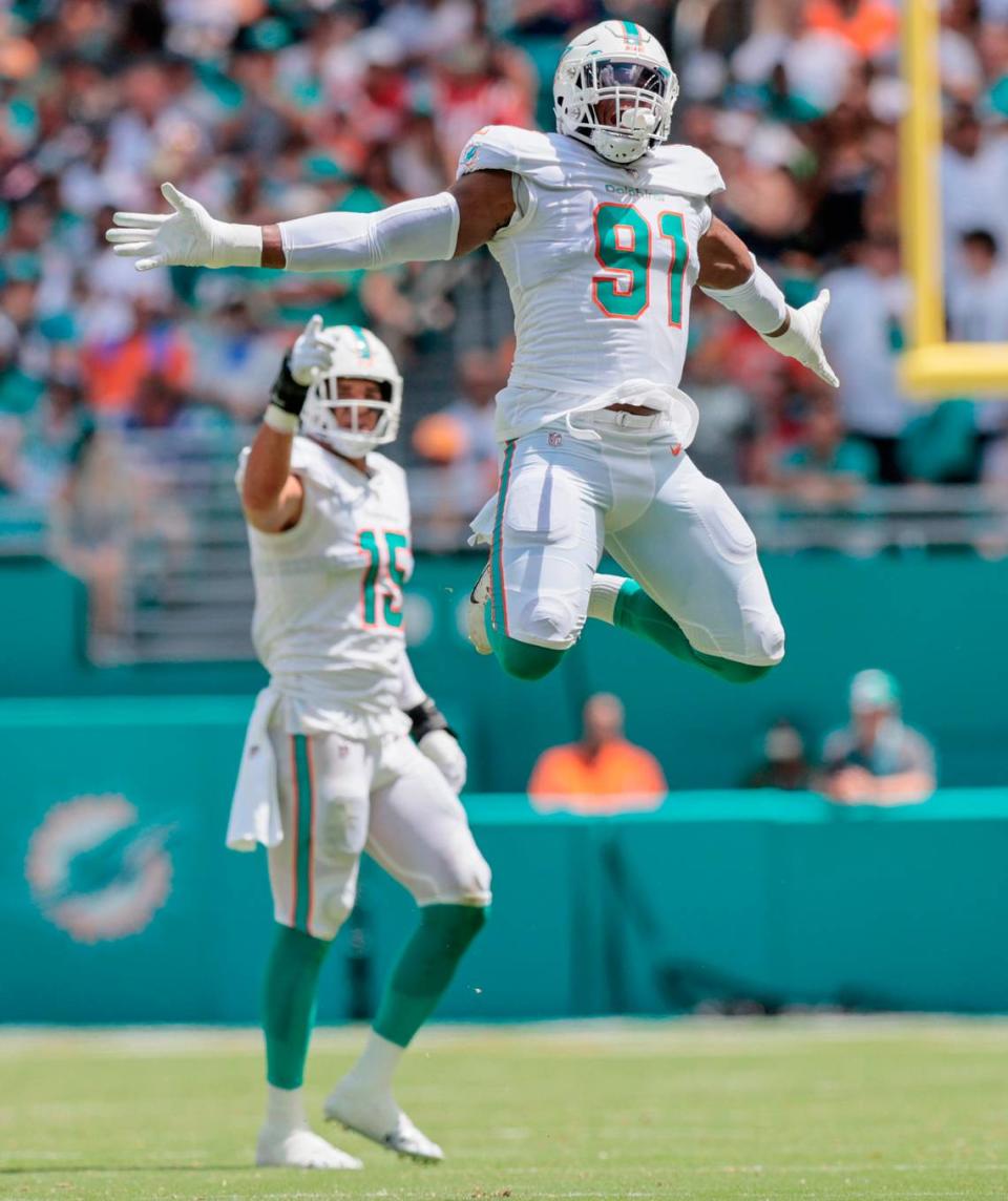 Miami Dolphins defensive end Emmanuel Ogbah (91) reacts after sacking New England Patriots quarterback Mac Jones (10) in the first quarter at Hard Rock Stadium in Miami Gardens on Sunday, September 11, 2022.