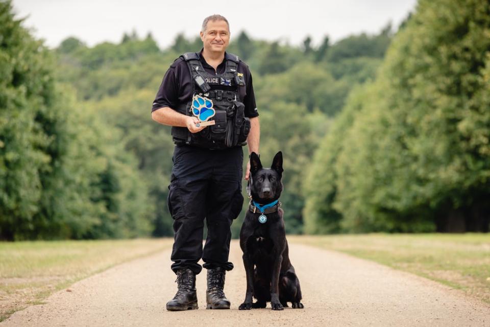 Pc Paul Hopley and West Midlands Police dog Stark (Penny Bird/Thin Blue Paw Awards/PA) (PA Media)