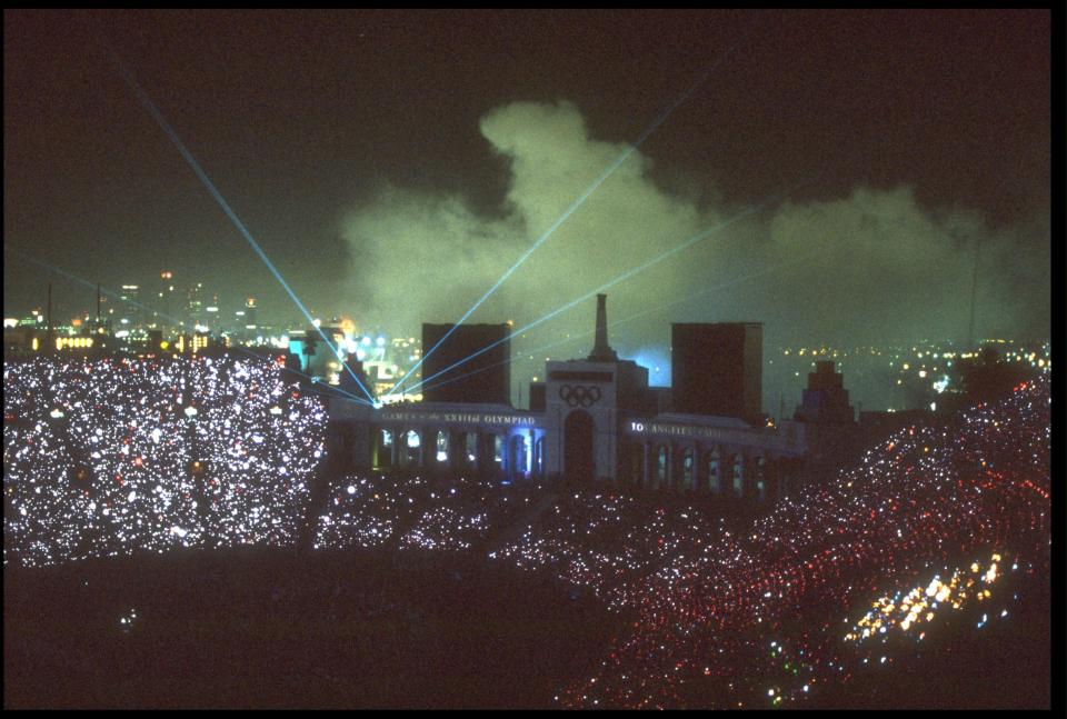 A laser show illuminates the sky during the Closing Ceremony of the 1984 Olympic Games held in the Los Angeles Memorial Coliseum. (Getty Images)