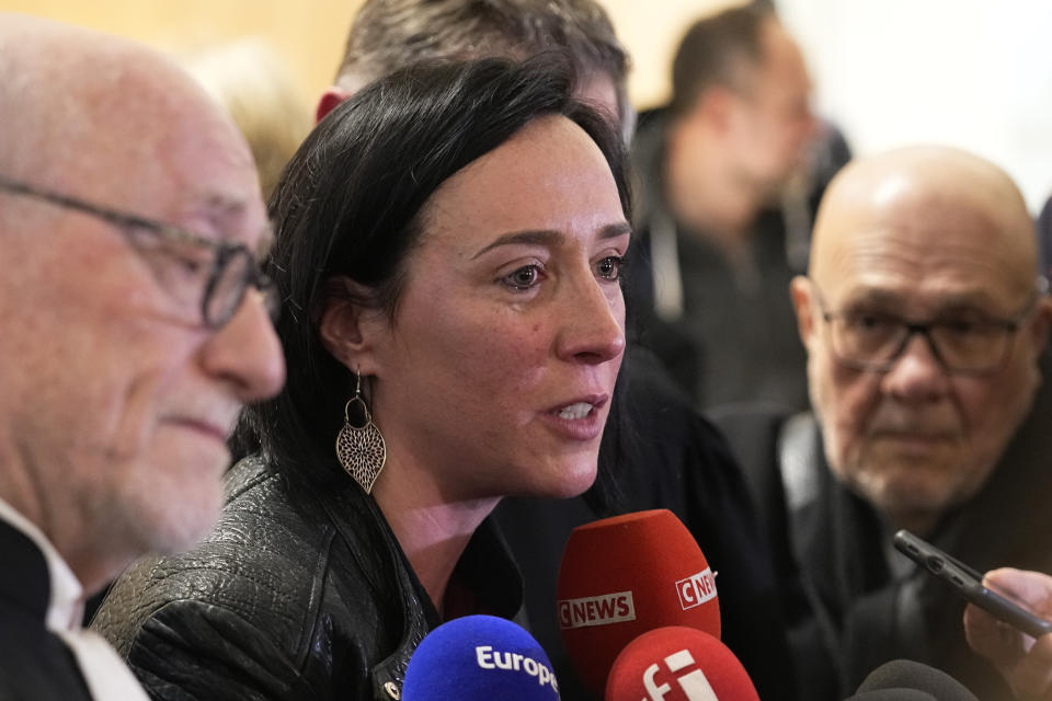 Alain Jakubowicz, left, a lawyer for the "AF447 Help and Solidarity" association, and Ophelie Touillou, a sister of a victim, answer reporters after the verdict outside the courtroom, Monday, April 17, 2023 in Paris. A French court acquitted Airbus and Air France of manslaughter charges over the 2009 crash of Flight 447 from Rio to Paris, which killed 228 people and led to lasting changes in aircraft safety measures. (AP Photo/Michel Euler)