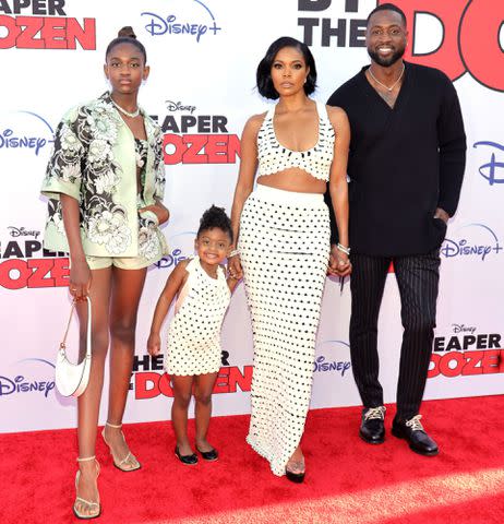 Matt Winkelmeyer/Getty Gabrielle Union and Dwyane Wade with daughters Zaya (far left) and Kaavia.