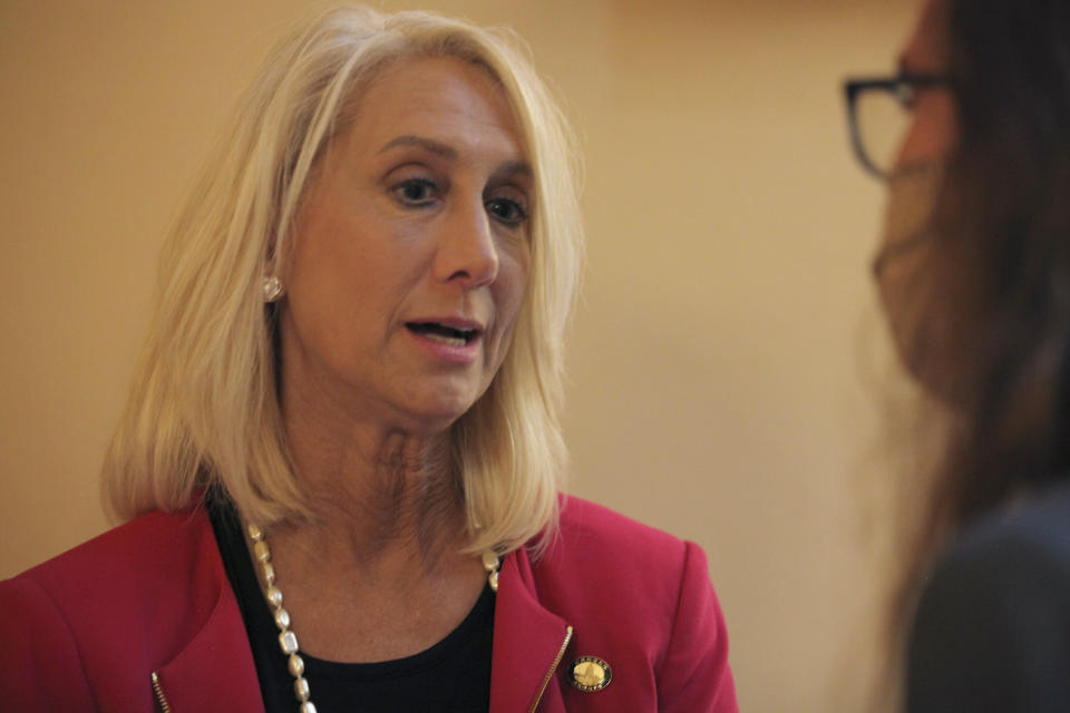 Kansas state Sen. Renee Erickson, R-Wichita, answers questions from reporters before a vote on a proposed ban on transgender athletes in girls' and women's school sports, Monday, May 3, 2021, at the Statehouse in Topeka, Kan. Erickson has pushed to override Democratic Gov. Laura Kelly's veto of the measure, but the override attempt has failed. (AP Photo/John Hanna)