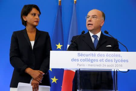 French Interior Minister Bernard Cazeneuve (R) and Education Minister Najat Vallaud-Belkacem attend a news conference to announce security plans for schools, in Paris, France, August 24, 2016. REUTERS/Pascal Rossignol