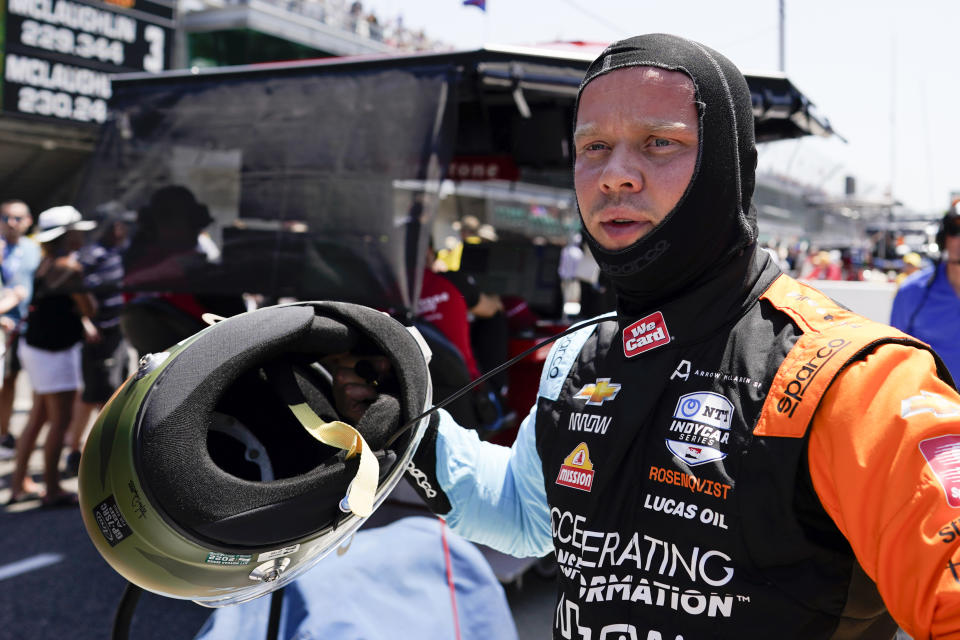 Felix Rosenqvist, of Sweden, takes off his helmet during practice for the Indianapolis 500 auto race at Indianapolis Motor Speedway, Friday, May 20, 2022, in Indianapolis. (AP Photo/Darron Cummings)