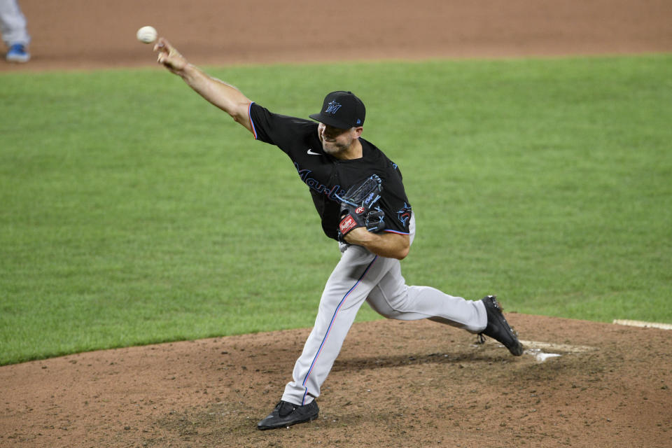 FILE - In this Aug. 6, 2020, file photo, Miami Marlins relief pitcher Brandon Kintzler delivers a pitch during the ninth inning of a baseball game against the Baltimore Orioles, in Baltimore. Marlins Park will have a new look for its 2020 season debut Friday, Aug. 14, 2020. And the roster looks a lot different than it did. (AP Photo/Nick Wass, File)