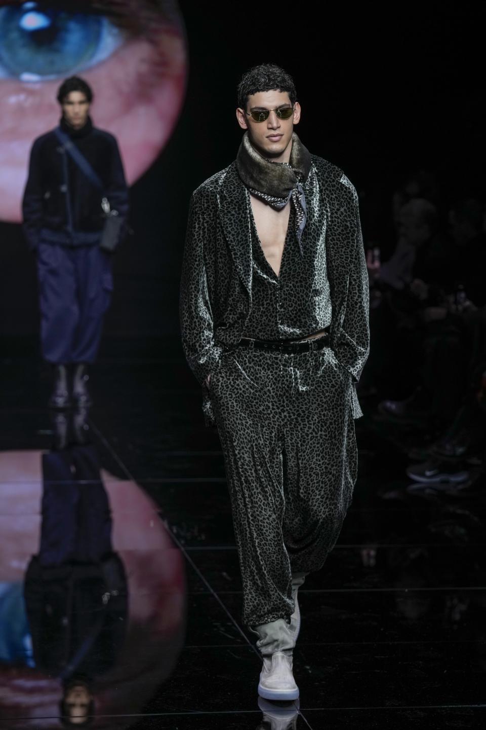 A model wears a creation part of the men's Giorgio Armani Fall-Winter 2024-2025 collection, that was presented in Milan, Italy, Sunday, Jan. 14, 2024. (AP Photo/Antonio Calanni).