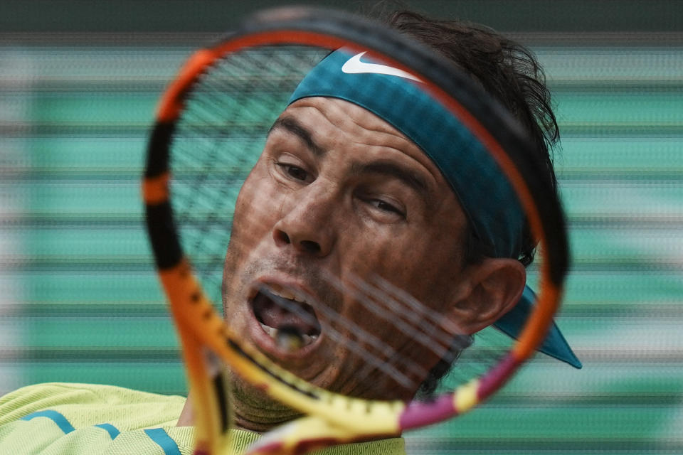 FILE - Spain's Rafael Nadal plays a shot against Australia's Jordan Thompson during their first round match at the French Open tennis tournament in Roland Garros stadium in Paris, France, Monday, May 23, 2022. Nadal is the defending men's champion at Melbourne Park and owner of a men's-record 22 major championships. (AP Photo/Thibault Camus, File)