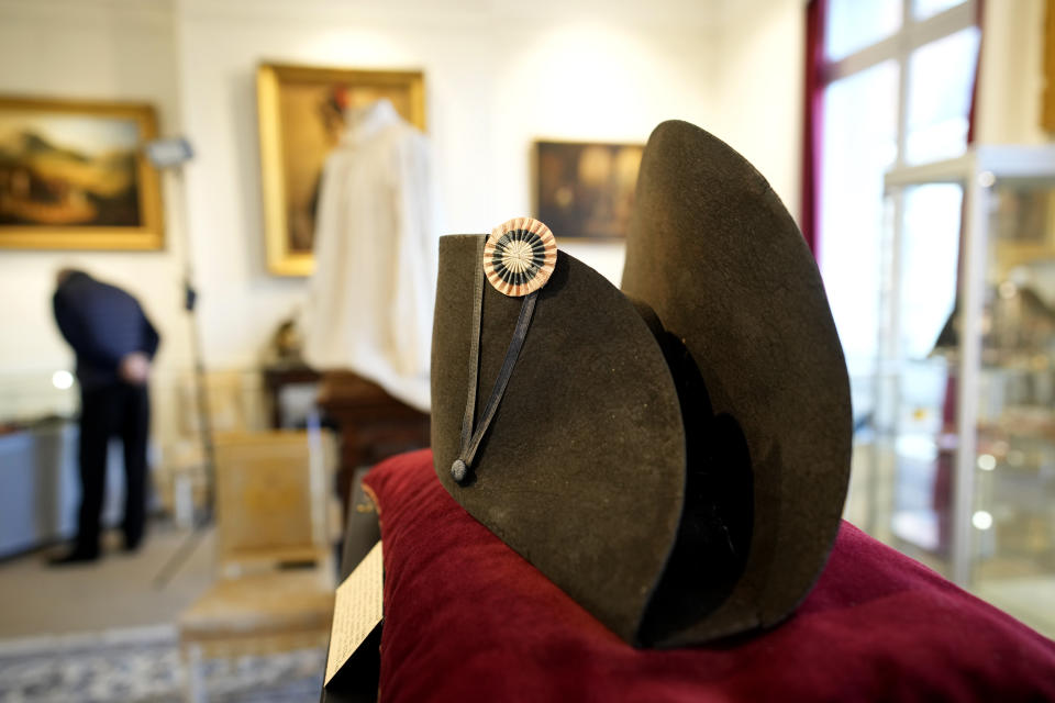 One of the signature broad, black hats that Napoléon wore when he ruled 19th century France and waged war in Europe is on display at Osenat's auction house in Fontainebleau, south of Paris, Friday, Nov. 17, 2023. The hat is tipped to fetch more than half a million euros (dollars) at the auction Sunday of Napoleonic memorabilia patiently collected by a French industrialist. (AP Photo/Christophe Ena)
