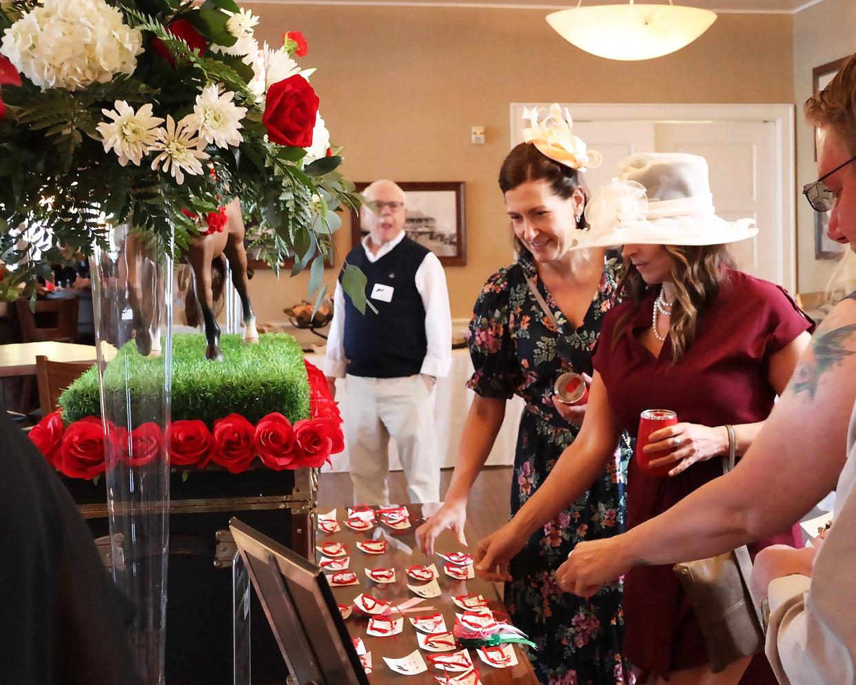 More than 120 community members attend the 2024 OASD Education Foundation Gala to support CTE. As guests arrived, they received a bracelet to give to the best dressed attendee as part of the evening’s festivities.