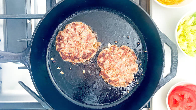 burgers in frying pan