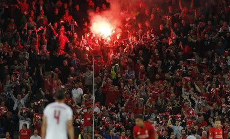 Football Soccer - Liverpool v Sevilla - UEFA Europa League Final - St. Jakob-Park, Basel, Switzerland - 18/5/16 Liverpool fans light a flare Reuters / Marcelo del Pozo Livepic