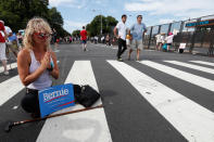 <p>Angel Settell, a supporter of Sen. Bernie Sanders prays in the middle of the street at Franklin Delano Roosevelt Park in Philadelphia, Tuesday, July 26, 2016, during the second day of the Democratic National Convention. (Photo: Alex Brandon/AP)</p>