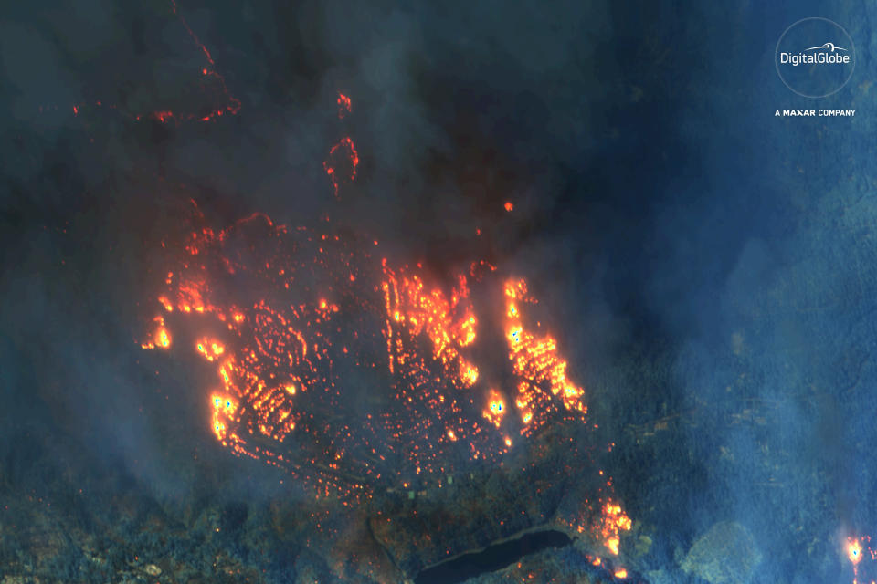 This Nov. 9, 2018 satellite image provided by DigitalGlobe shows fires consuming Paradise, Calif. (DigitalGlobe, a Maxar company via AP)