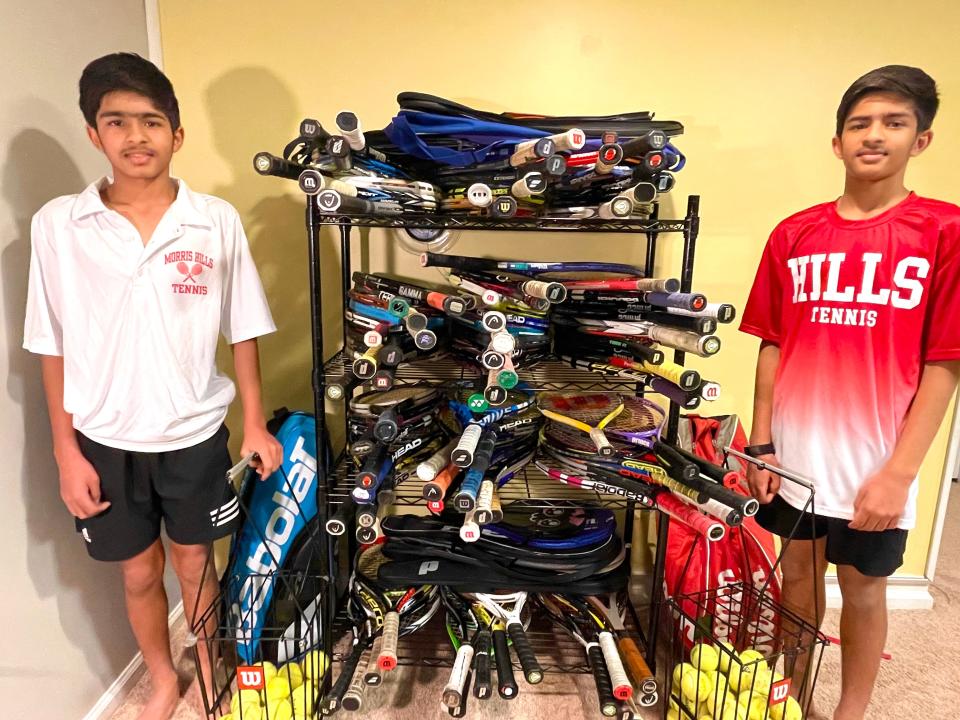 Parsippany twins Yash (red shirt) and Veer (white shirt) Gupta, Morris Hills High School freshmen, are collecting and refurbishing tennis rackets for Greater Newark Tennis & Education.