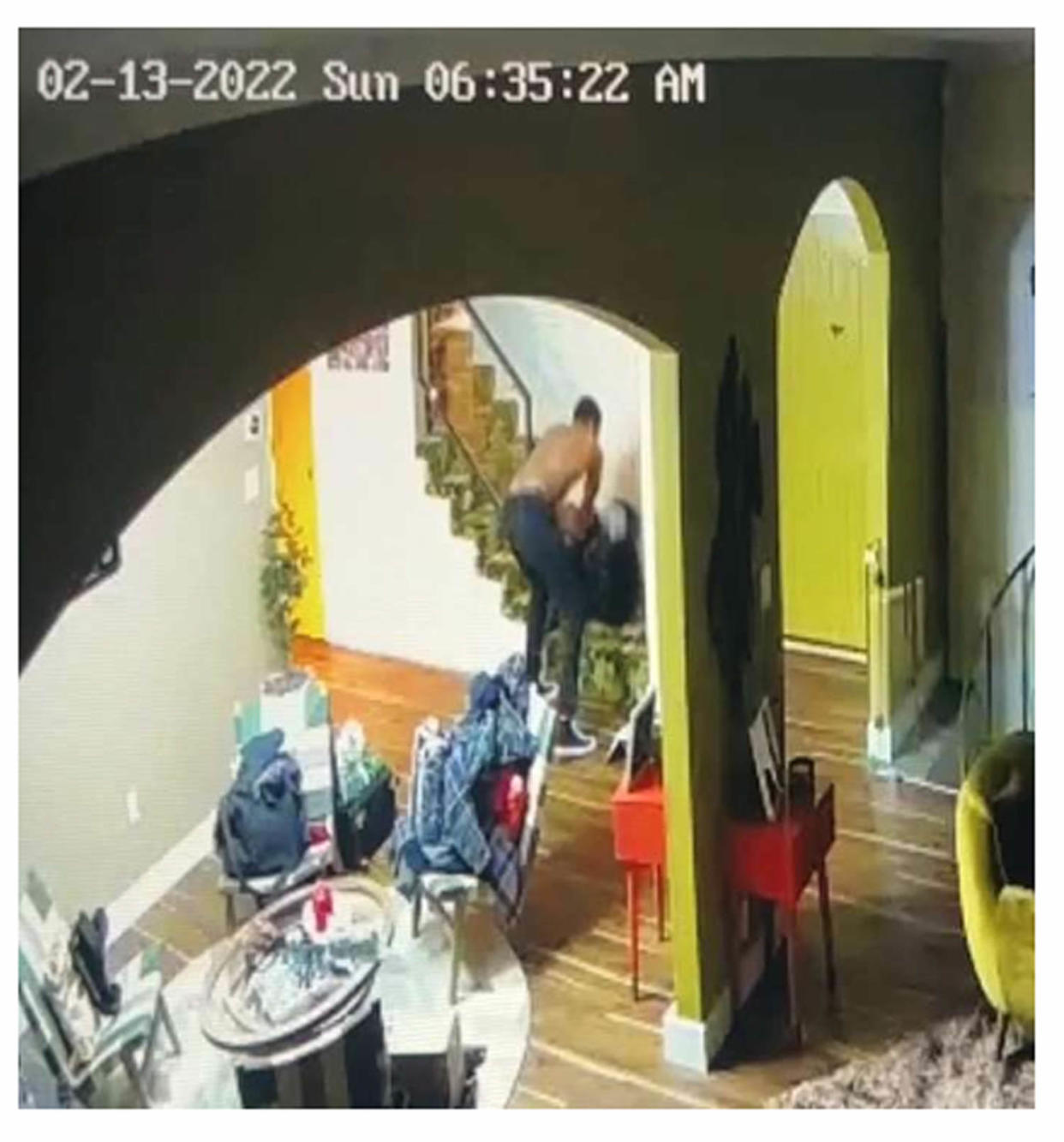 A screenshot from home surveillance footage showing Darius Jackson allegedly choking and body slamming Keke Palmer in her home on Feb. 13, 2022. (Superior Court of California County of Los Angeles)